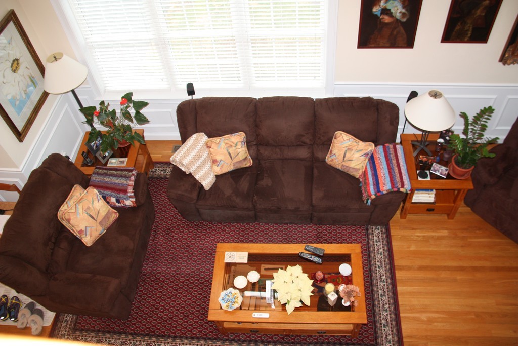 3 Ellsworth Village Road, Unit 2 Acton, MA 01720 - Photo 20 of 25 a living room with furniture and a fireplace