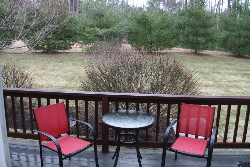3 Ellsworth Village Road, Unit 2 Acton, MA 01720 - Photo 3 of 25 a view of a balcony with chairs