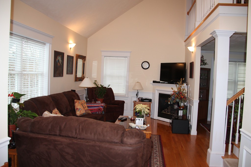 3 Ellsworth Village Road, Unit 2 Acton, MA 01720 - Photo 4 of 25 a living room with furniture and a flat screen tv