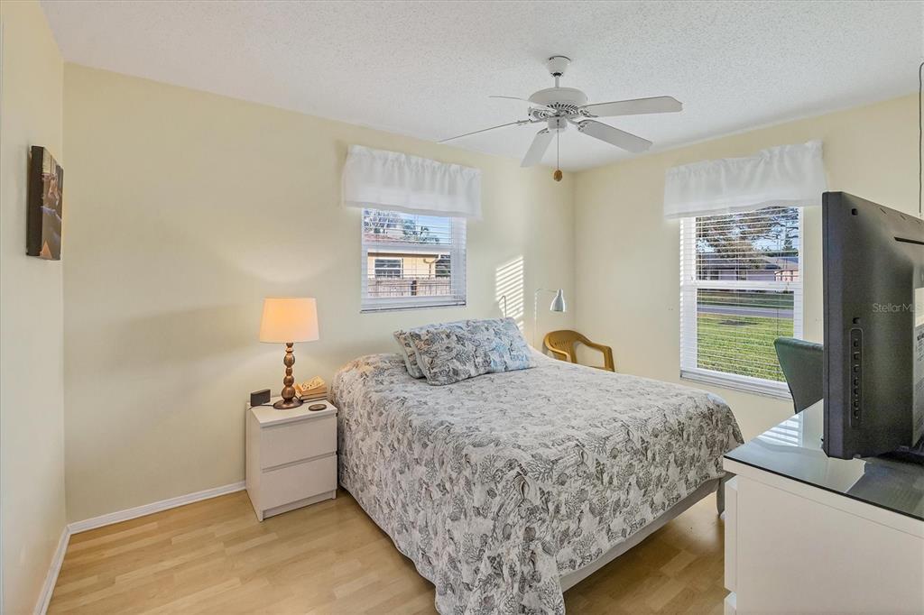 571 Morningside Road Venice, FL 34293 - Photo 11 of 36 a bedroom with a bed and a flat screen tv
