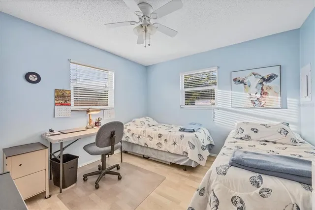 a bedroom with bed and a window