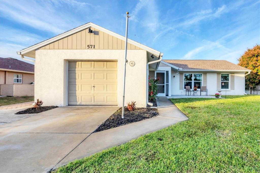 571 Morningside Road Venice, FL 34293 - Photo 24 of 36 a front view of a house with a yard