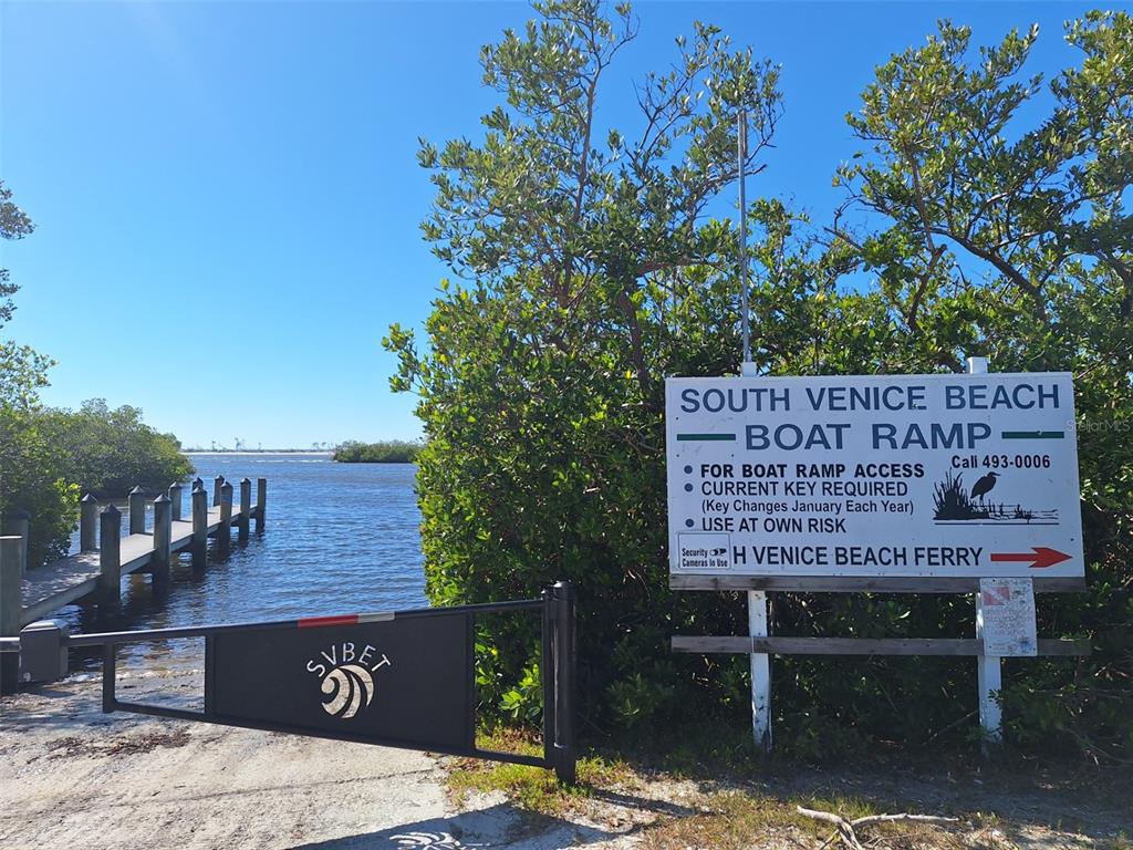 571 Morningside Road Venice, FL 34293 - Photo 32 of 36 a view of a wooden bench and trees in the background