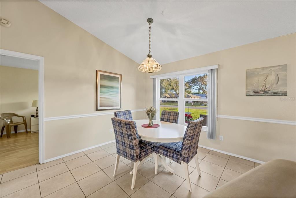 571 Morningside Road Venice, FL 34293 - Photo 6 of 36 a dining room with furniture and window