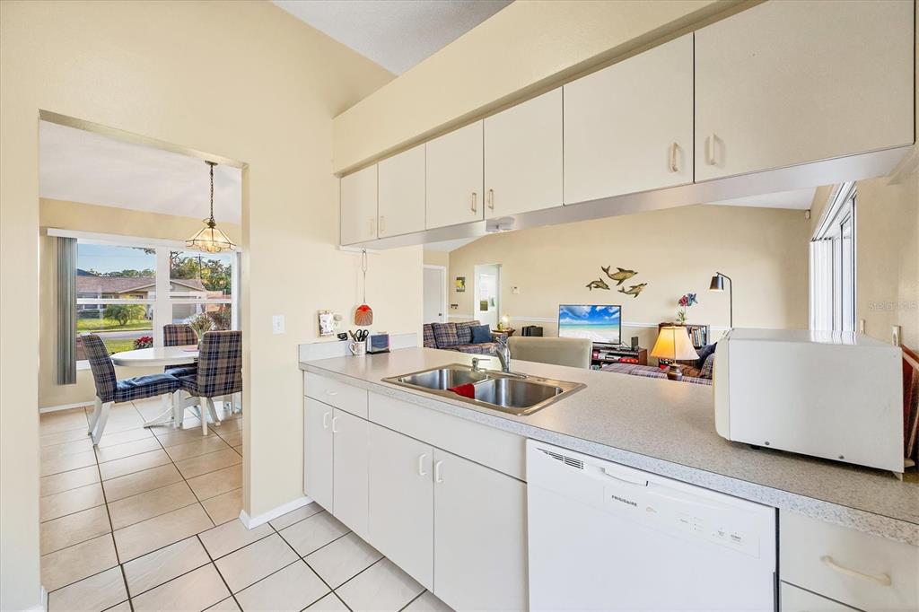 571 Morningside Road Venice, FL 34293 - Photo 10 of 36 a kitchen with sink cabinets and appliances