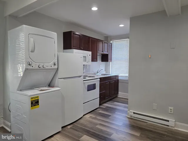 a kitchen with a sink a stove and refrigerator