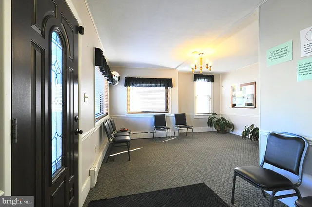 a room with furniture and a chandelier