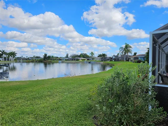 a view of a swimming pool with outdoor seating
