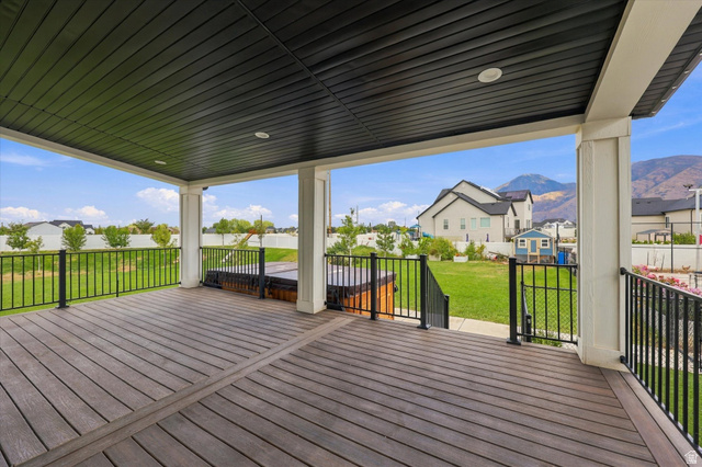 754 West 400 North Mapleton, UT 84664 - Photo 70 of 86 Large covered deck with recessed lighting, composite decking, and black metal railings.