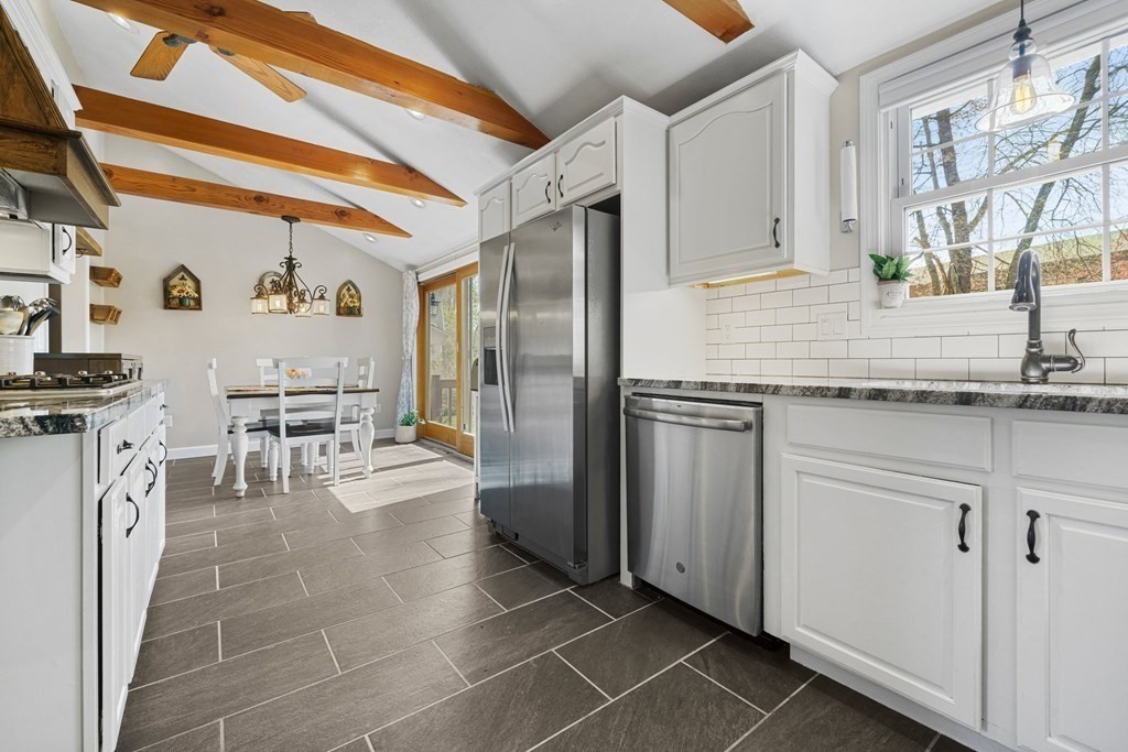 18 Corcoran Road Billerica, MA 01821 - Photo 13 of 40 a kitchen with stainless steel appliances granite countertop a refrigerator and a stove