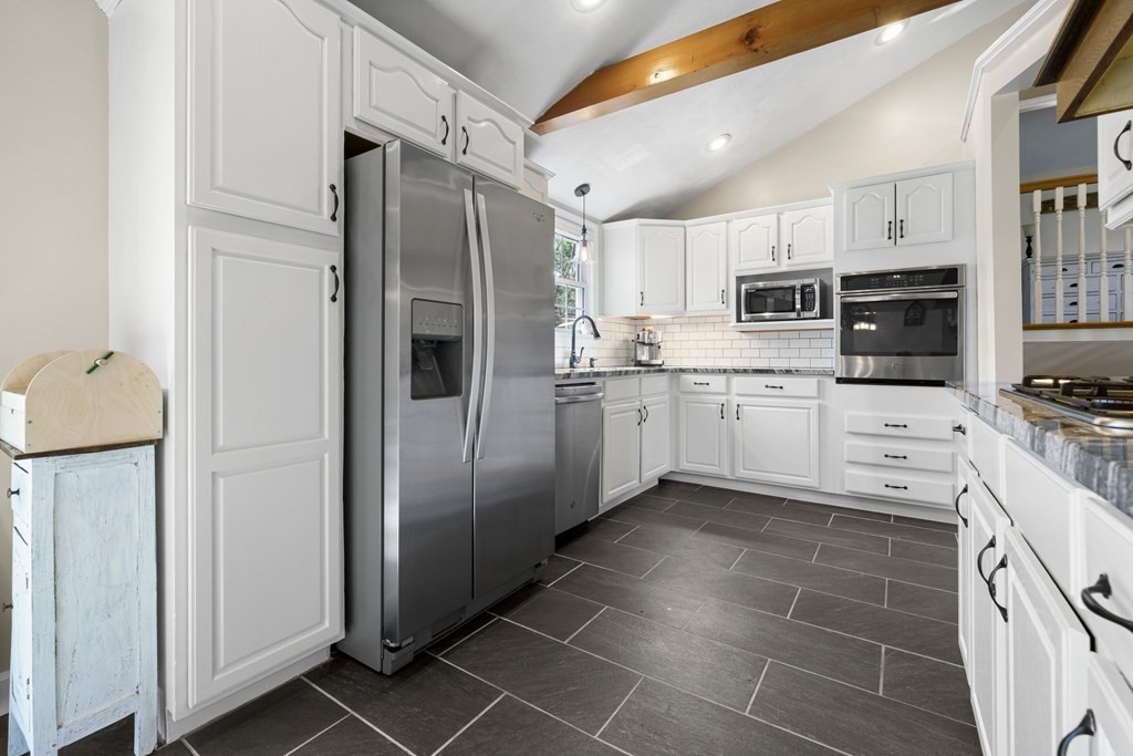 18 Corcoran Road Billerica, MA 01821 - Photo 15 of 40 a kitchen with stainless steel appliances a refrigerator sink and microwave