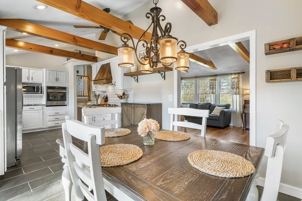 18 Corcoran Road Billerica, MA 01821 - Photo 16 of 40 a kitchen with furniture and a dining table