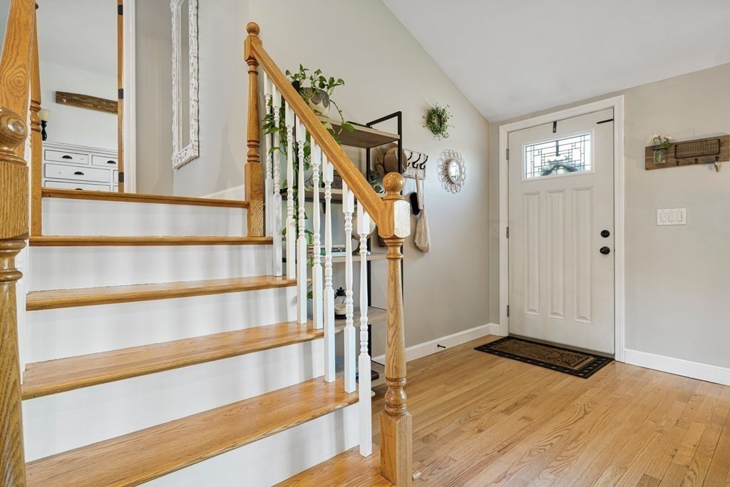 18 Corcoran Road Billerica, MA 01821 - Photo 18 of 40 a view of front door with hallway and wooden floor