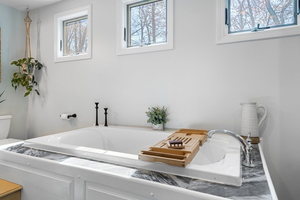 18 Corcoran Road Billerica, MA 01821 - Photo 20 of 40 a bedroom with a bed and a window