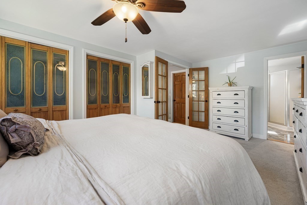 18 Corcoran Road Billerica, MA 01821 - Photo 24 of 40 a bedroom with a large bed and a window