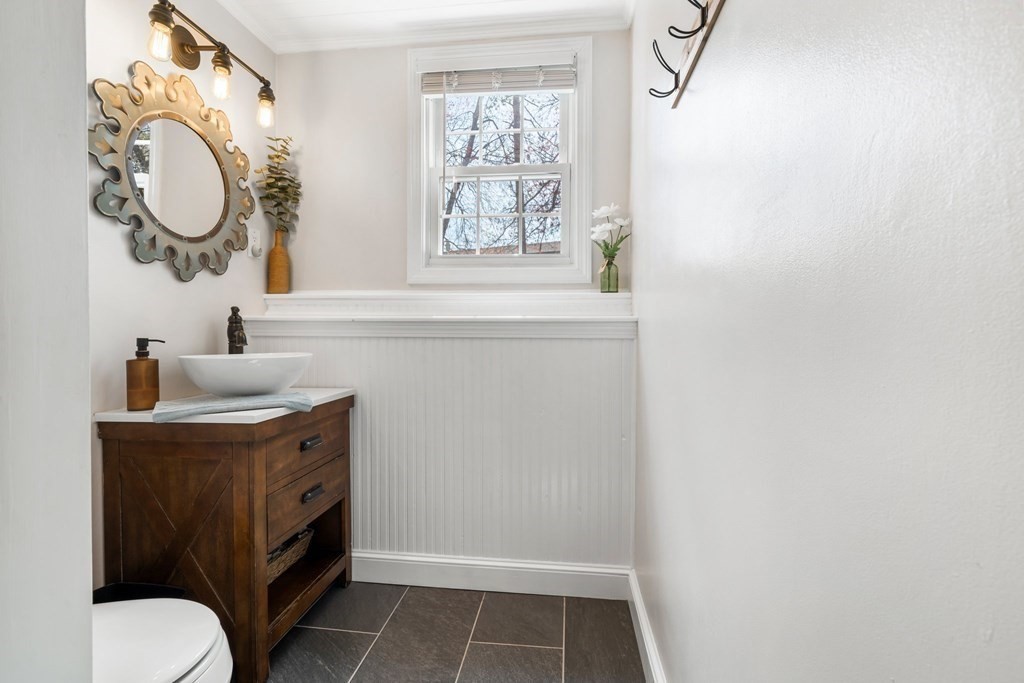 18 Corcoran Road Billerica, MA 01821 - Photo 28 of 40 a bathroom with a sink a toilet and a window