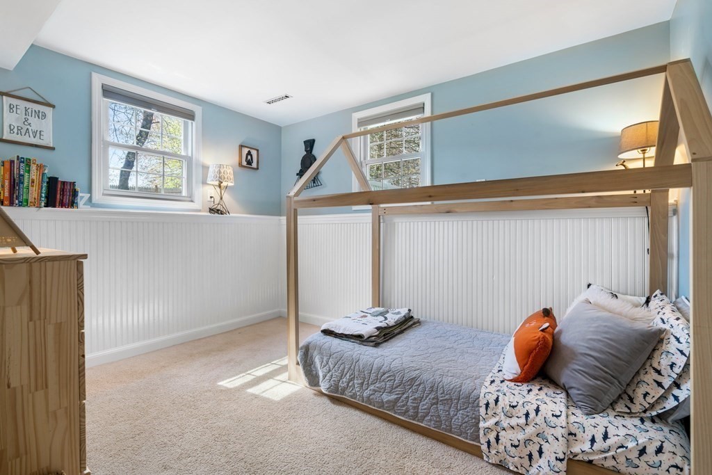 18 Corcoran Road Billerica, MA 01821 - Photo 30 of 40 a bedroom with a large bed and a window