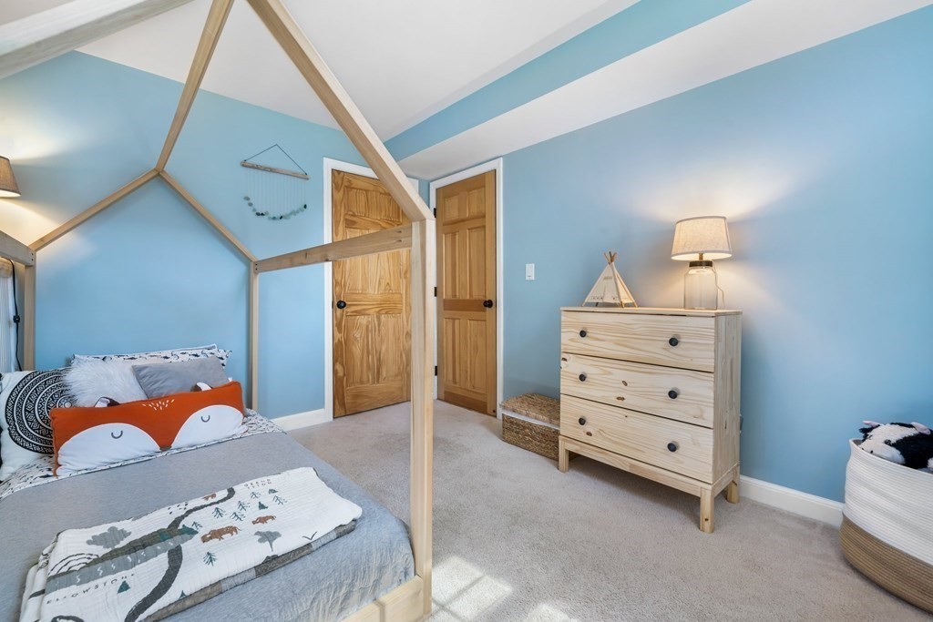 18 Corcoran Road Billerica, MA 01821 - Photo 31 of 40 a bedroom with a bed and a dresser