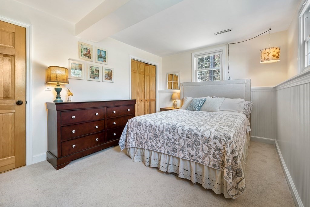 18 Corcoran Road Billerica, MA 01821 - Photo 33 of 40 a bedroom with a bed and a dresser