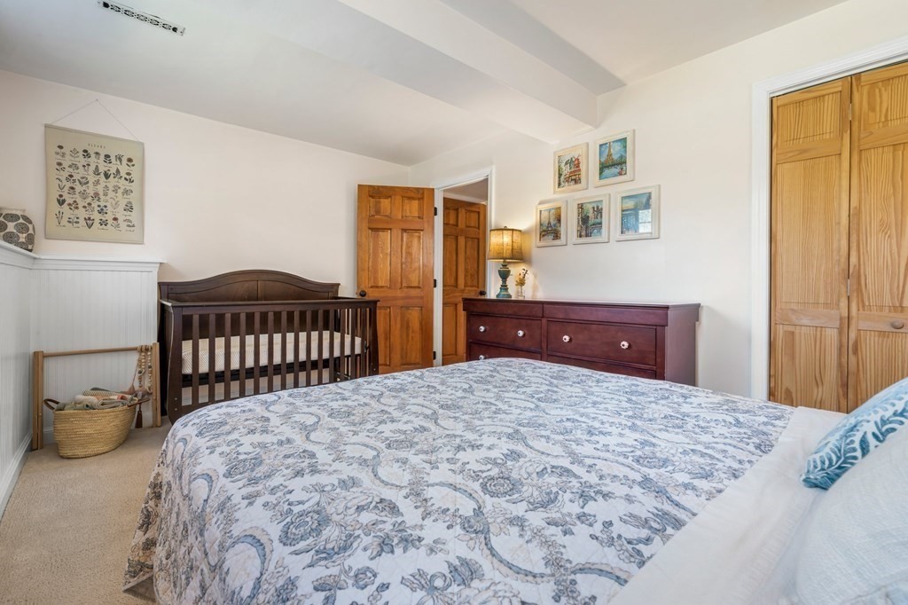 18 Corcoran Road Billerica, MA 01821 - Photo 34 of 40 a bedroom with a bed and a dresser