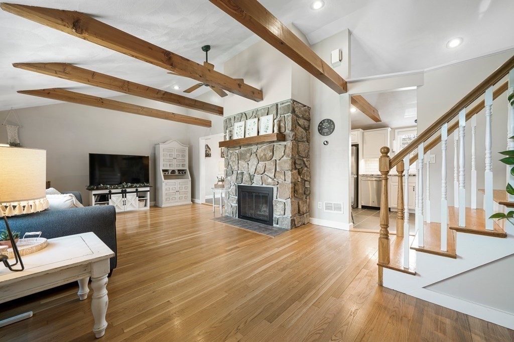 18 Corcoran Road Billerica, MA 01821 - Photo 6 of 40 a living room with fireplace furniture and a flat screen tv