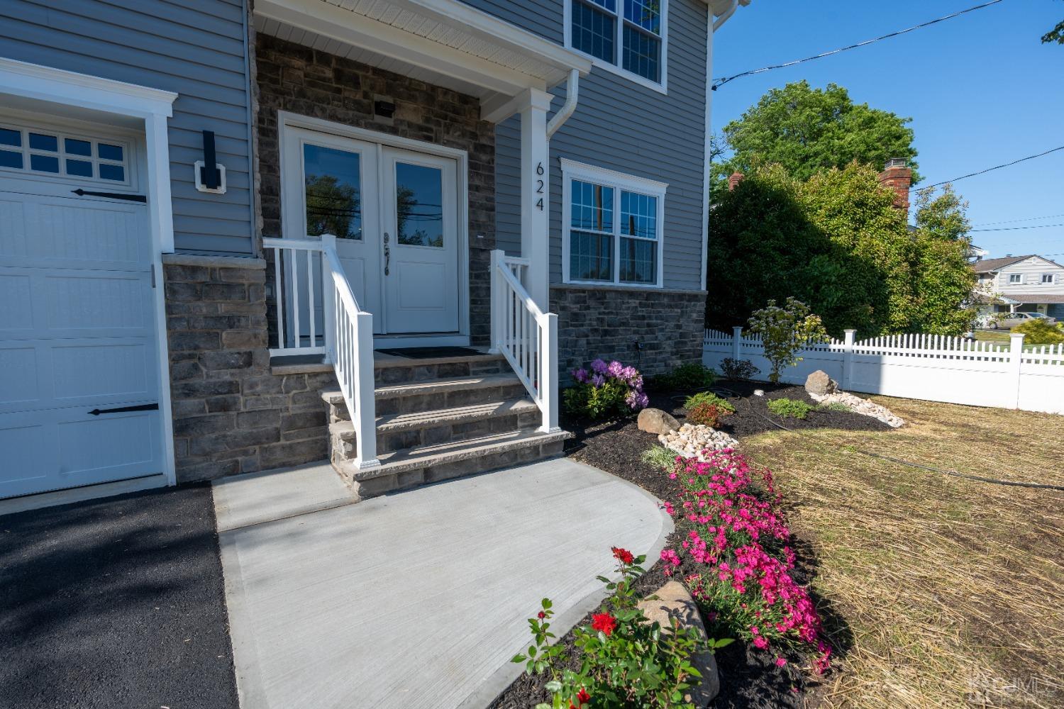 624 New Dover Road Colonia, NJ 07067 - Photo 2 of 29 a view of a house with potted plants