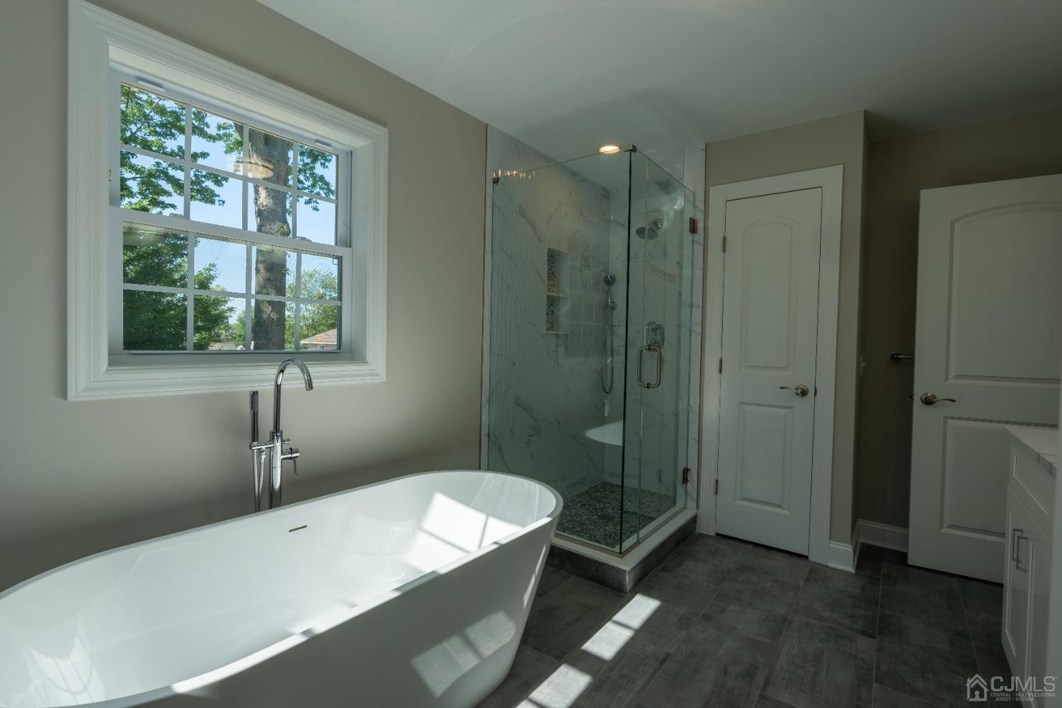 624 New Dover Road Colonia, NJ 07067 - Photo 27 of 29 a bathroom with a sink a toilet and shower