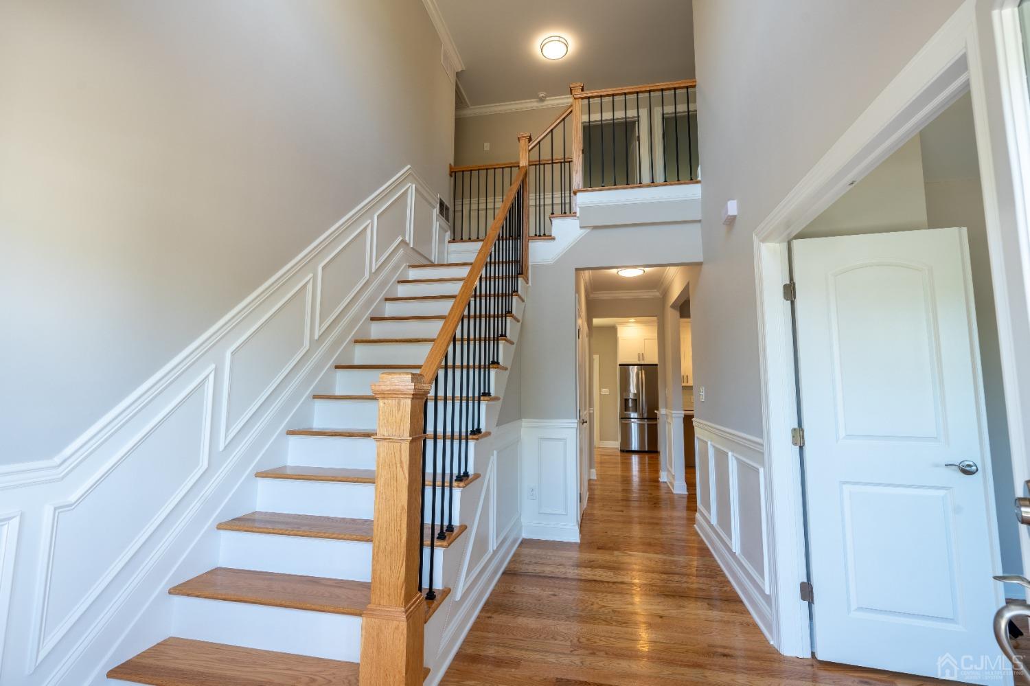624 New Dover Road Colonia, NJ 07067 - Photo 3 of 29 a view of a hallway with wooden floor and entryway