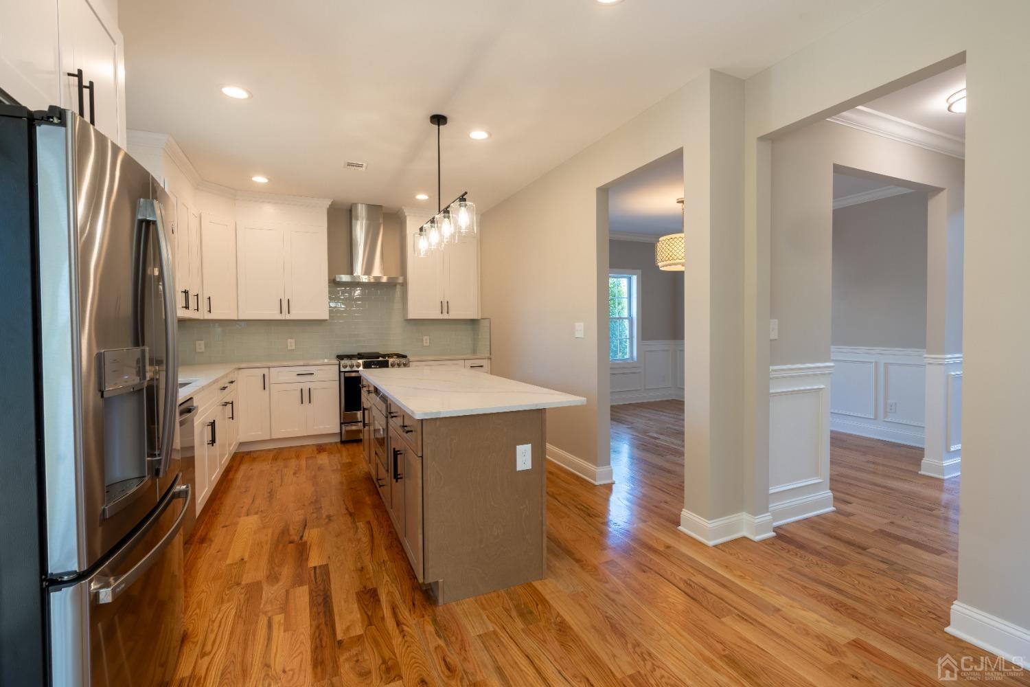 624 New Dover Road Colonia, NJ 07067 - Photo 9 of 29 a kitchen with stainless steel appliances granite countertop a refrigerator a sink and a stove
