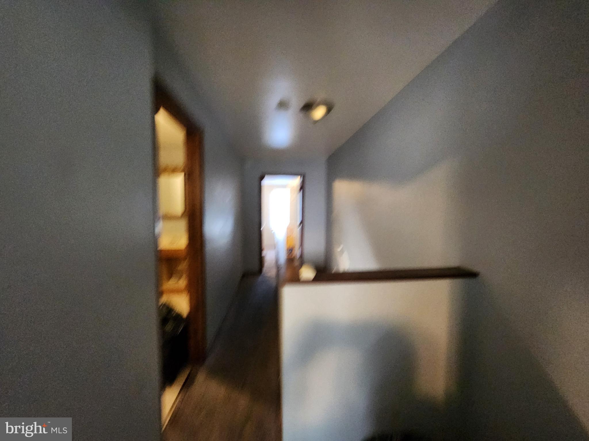 1182 Nanticoke Street Baltimore, MD 21230 - Photo 16 of 26 a view of a hallway with windows