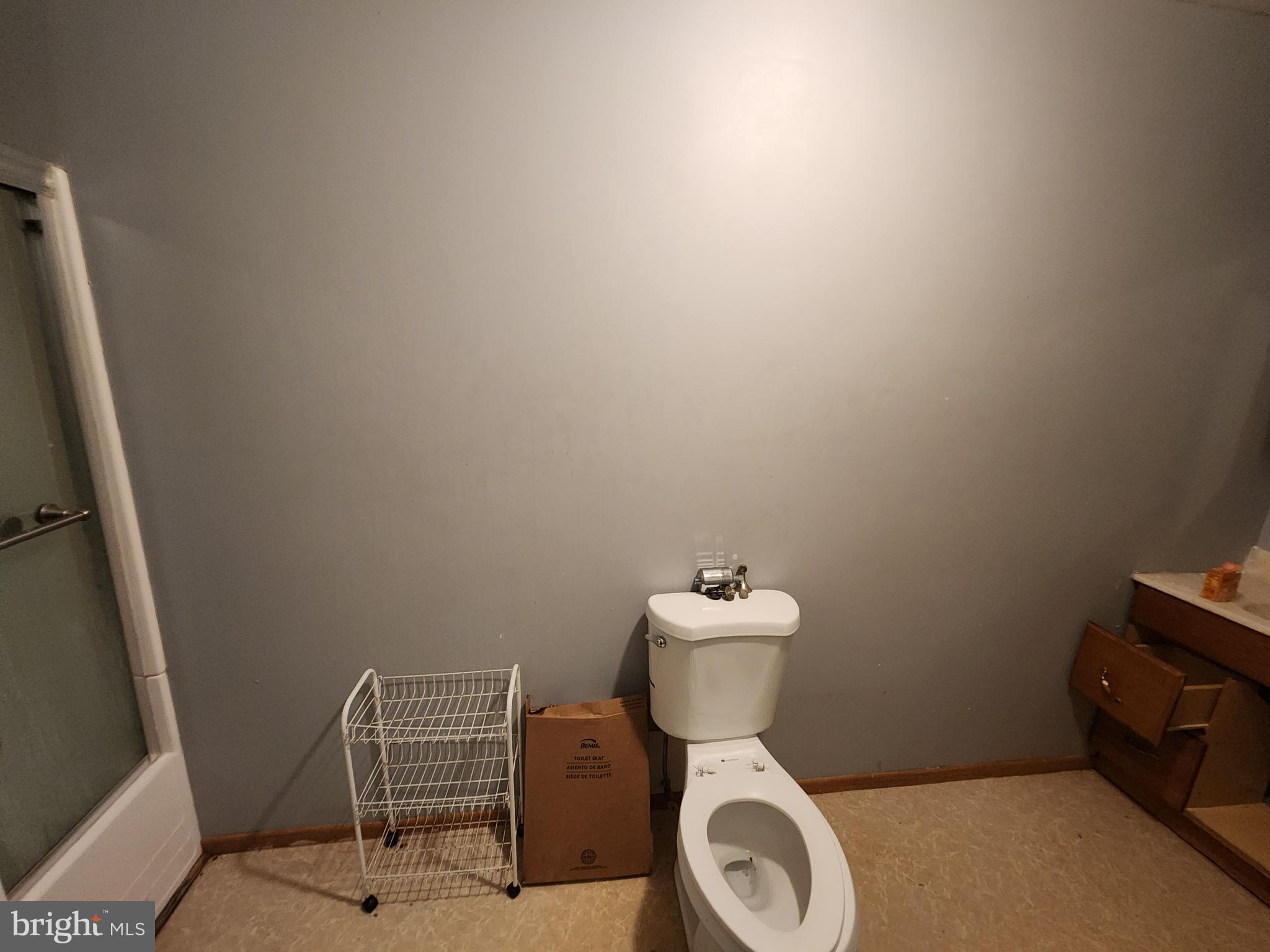 1182 Nanticoke Street Baltimore, MD 21230 - Photo 20 of 26 a white toilet sitting next to a small bathroom