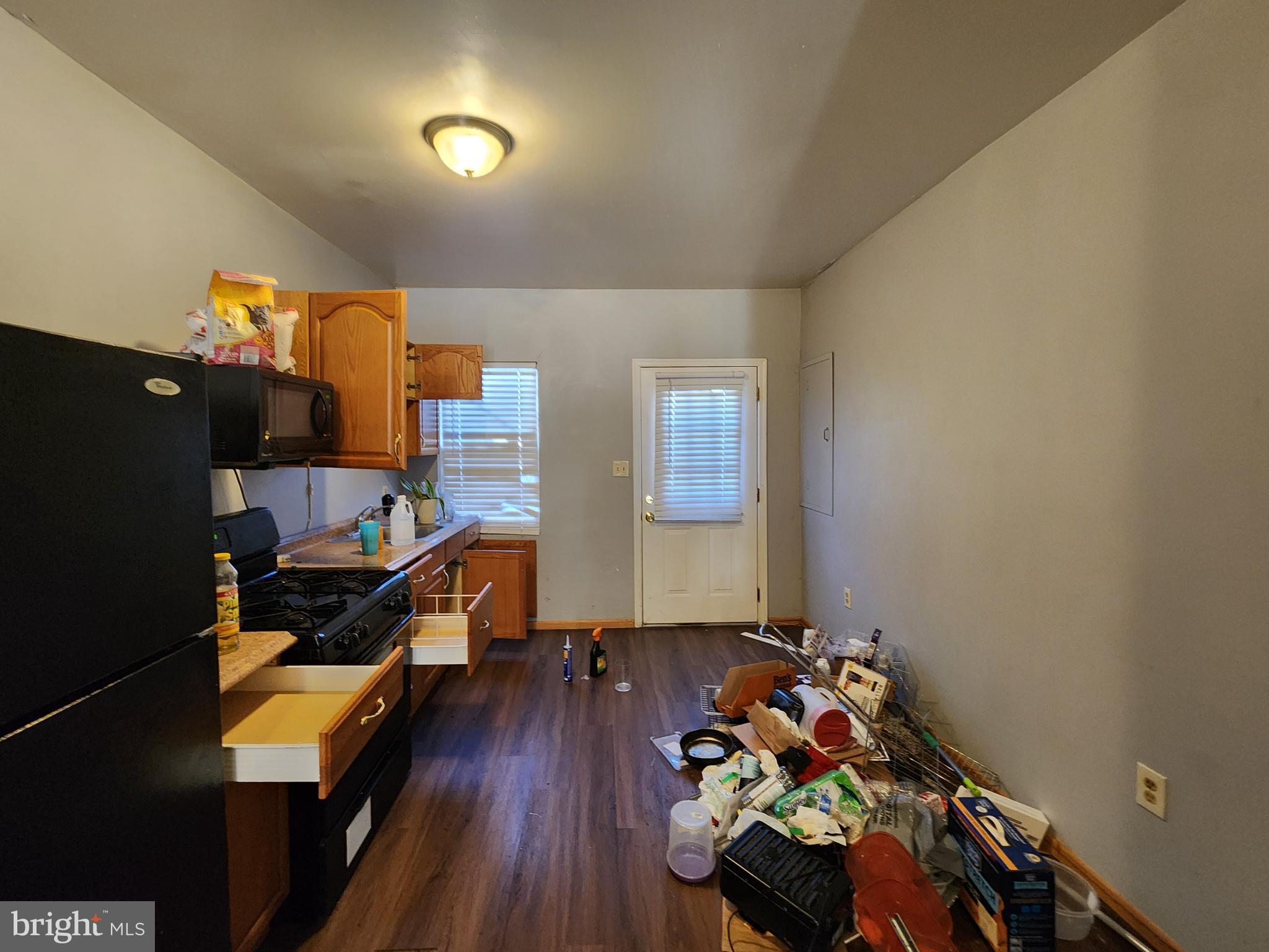 1182 Nanticoke Street Baltimore, MD 21230 - Photo 6 of 26 a room with furniture and wooden floor