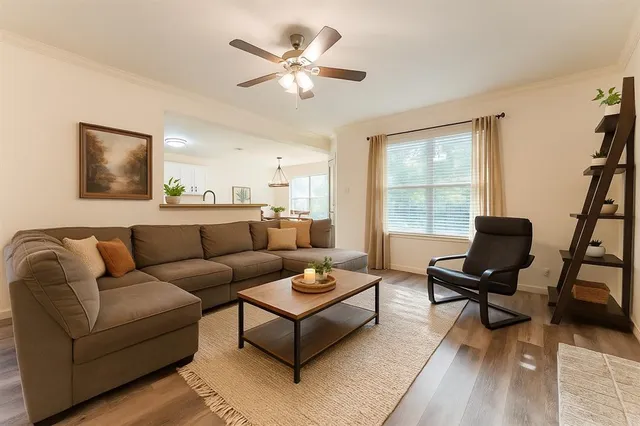 a living room with furniture and a window