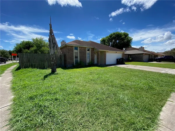 a view of a backyard of the house