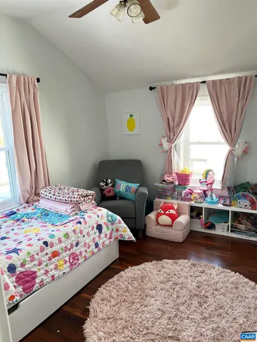 a bedroom with bed and window