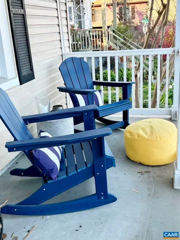 a view of a balcony with chairs