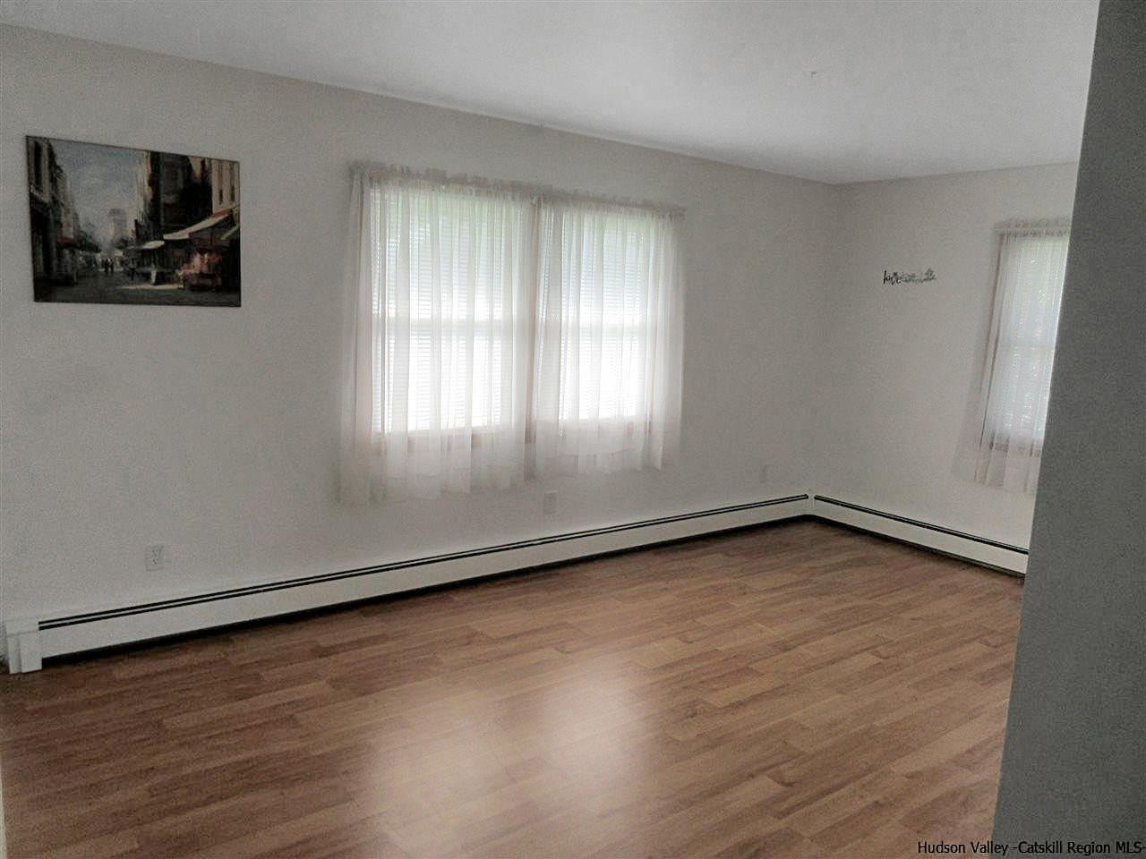 15 Old Lasher Road Saugerties, NY 12477 - Photo 6 of 18 an empty room with wooden floor and windows