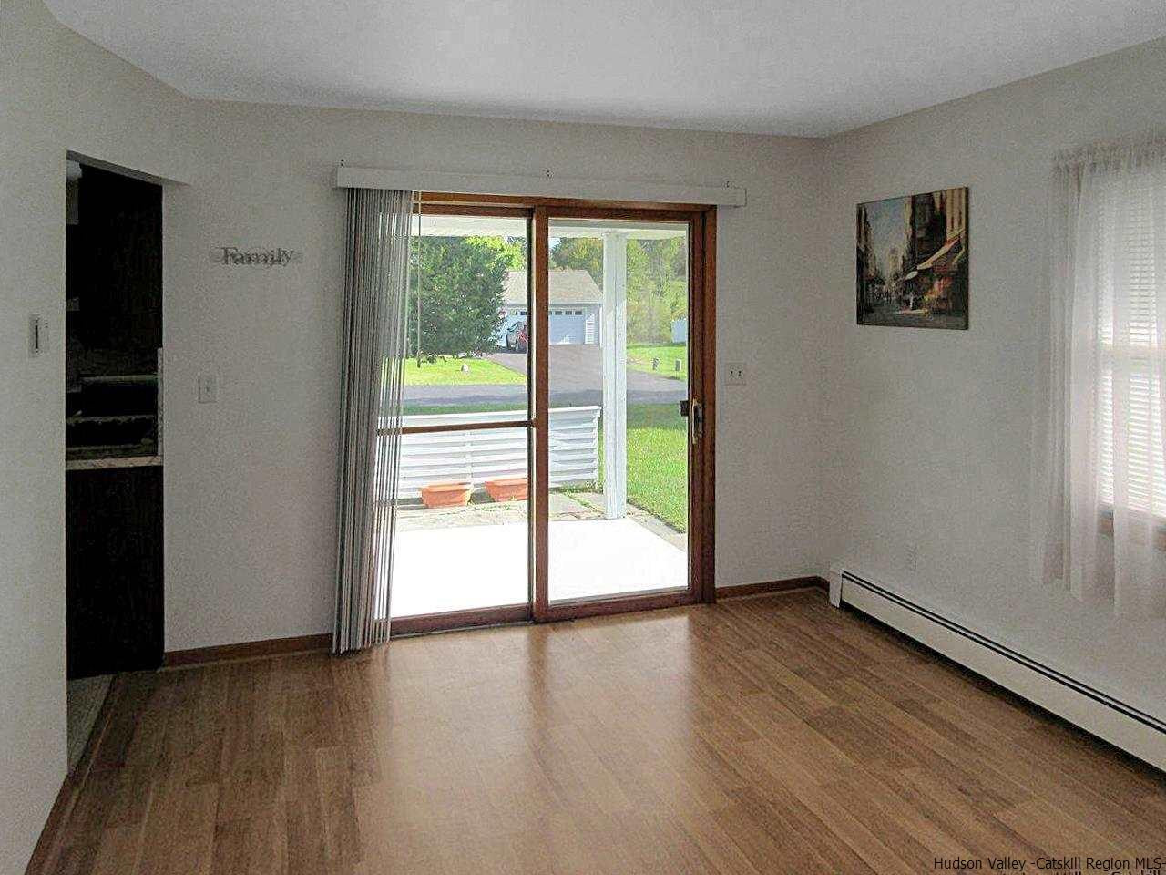 15 Old Lasher Road Saugerties, NY 12477 - Photo 7 of 18 a view of an empty room with wooden floor and a window