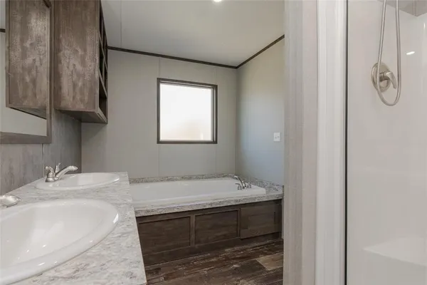a bathroom with a sink and vanity