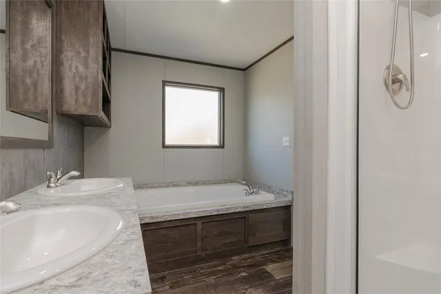 a bathroom with a sink and vanity