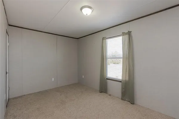 a view of a field with an ocean