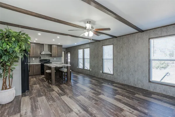 a view of a kitchen and dining room