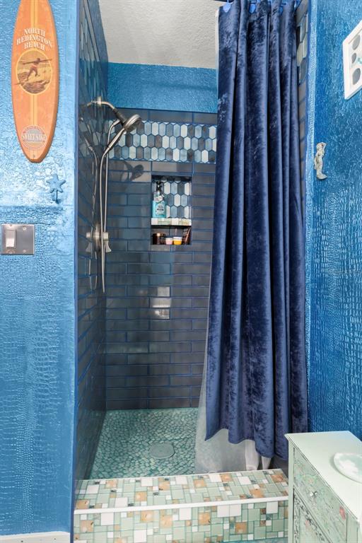 16333 Gulf Boulevard, Unit 113 Redington Beach, FL 33708 - Photo 18 of 40 a bathroom with a granite countertop sink and a mirror