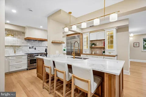a kitchen with cabinets a sink and appliances