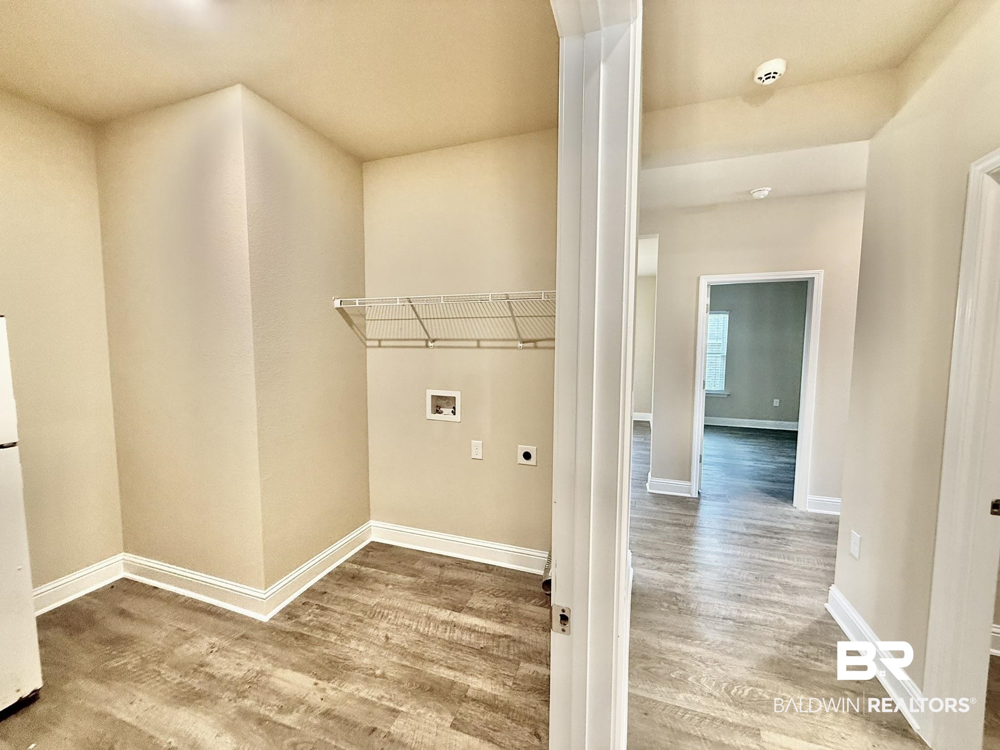 8648 Calverton Street Foley, AL 36535 - Photo 30 of 45 Washroom featuring electric dryer hookup, washer hookup, and wood finished floors