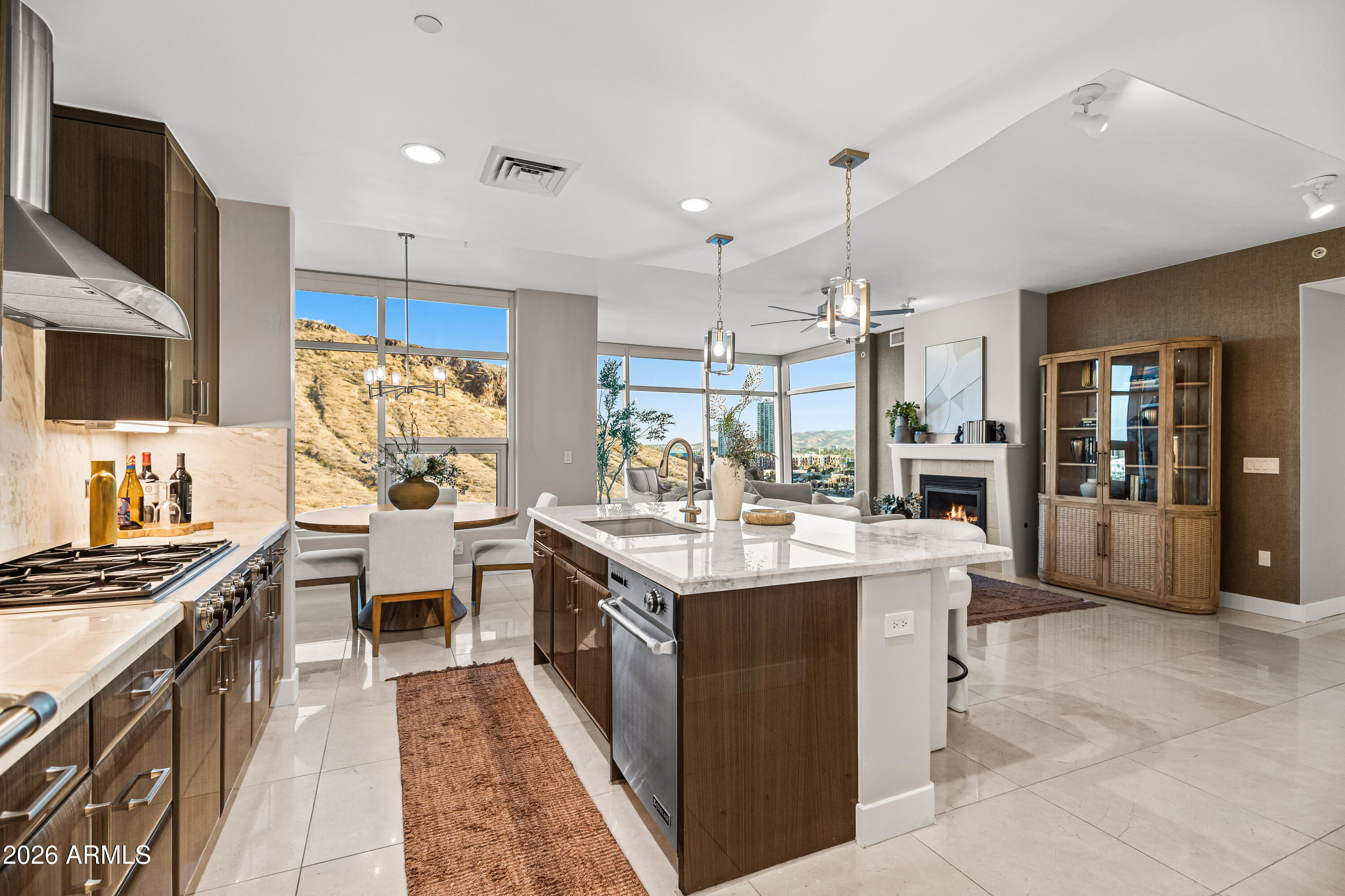 140 East Rio Salado Parkway, Unit 1101 Tempe, AZ 85281 - Photo 6 of 32 a kitchen with kitchen island a stove a sink a oven and a refrigerator