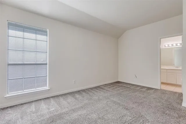 an empty room with a fireplace