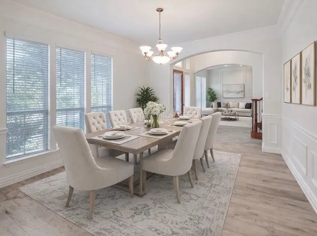 a view of a dining room with furniture window and wooden floor