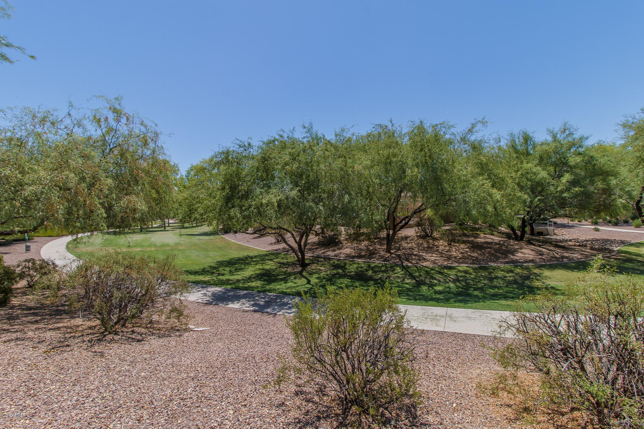 4265 East Buckboard Road Gilbert, AZ 85297 - Photo 34 of 55 34) GREENBELT OVER FENCE