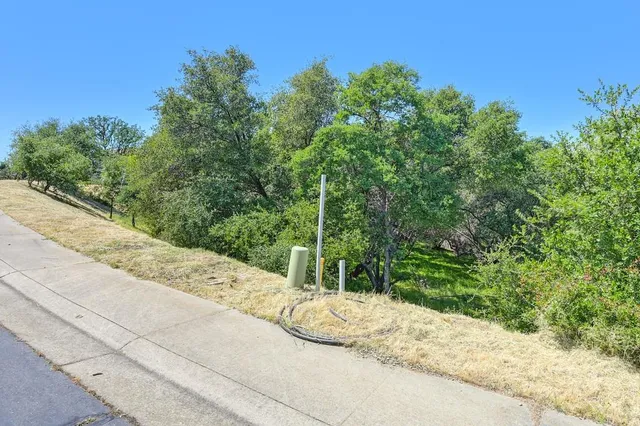 a view of a road with a yard